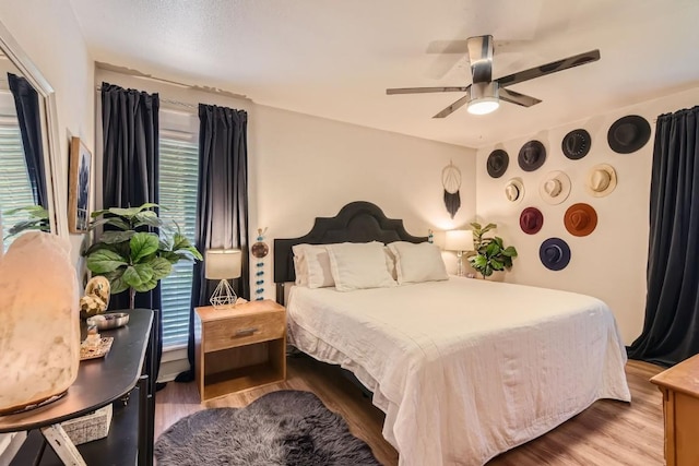 bedroom featuring ceiling fan and wood finished floors