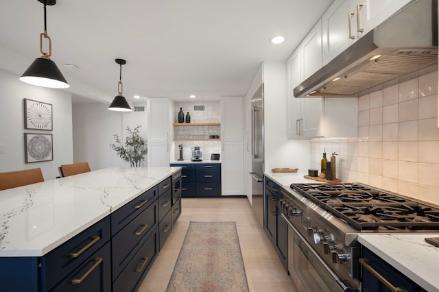 kitchen with blue cabinetry, open shelves, white cabinetry, stovetop, and under cabinet range hood