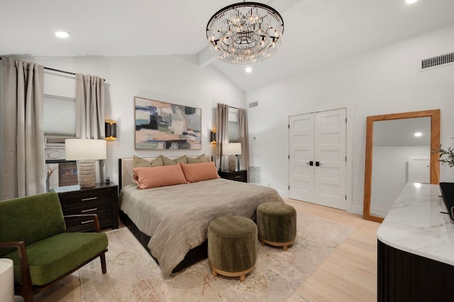 bedroom with lofted ceiling, recessed lighting, visible vents, light wood-style floors, and a closet