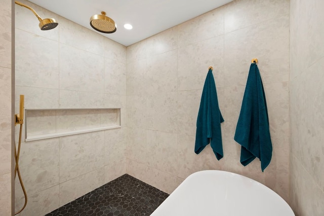 bathroom with recessed lighting, a soaking tub, and a tile shower