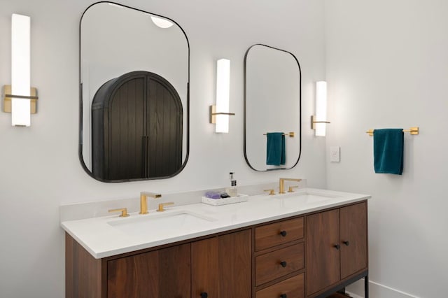 full bath featuring double vanity and a sink