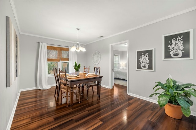 dining room featuring baseboards, crown molding, visible vents, and dark wood-style flooring