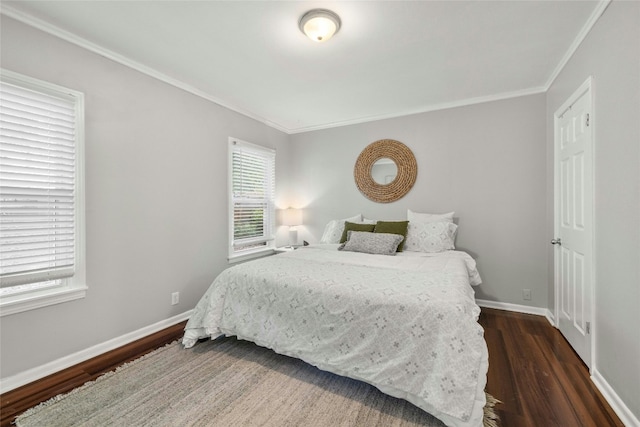 bedroom featuring crown molding, baseboards, and dark wood-style flooring