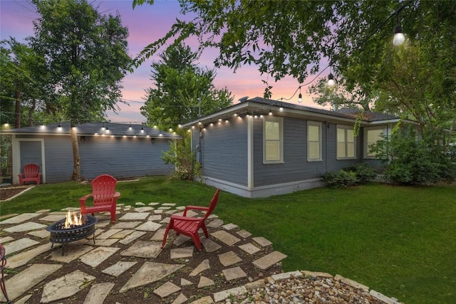 1906 Paige St, Georgetown, TX 78626 - exterior space featuring a fire pit, a patio area, and an outbuilding