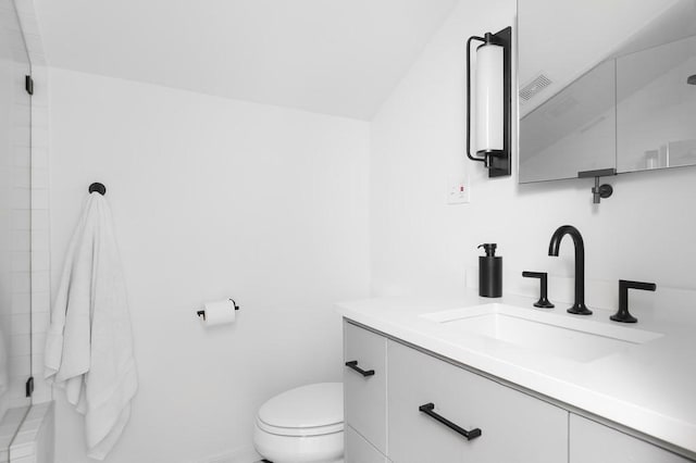 full bath featuring visible vents, vanity, toilet, and walk in shower