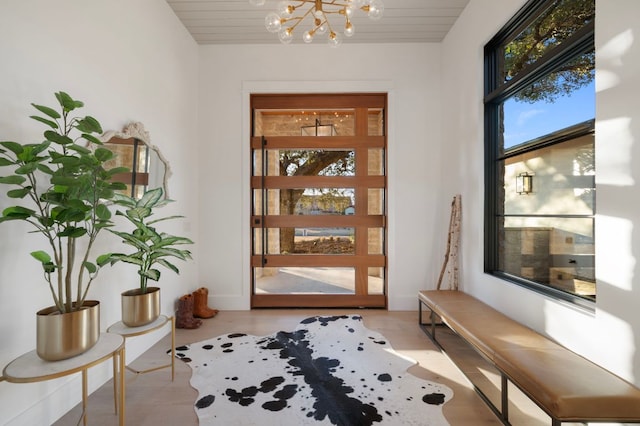 entryway featuring a chandelier