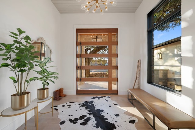200 Birdstone Ln, Georgetown, TX 78628 - entrance foyer featuring a chandelier and light wood finished floors