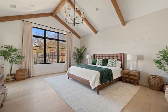 bedroom featuring visible vents, an inviting chandelier, beam ceiling, and light wood-style floors