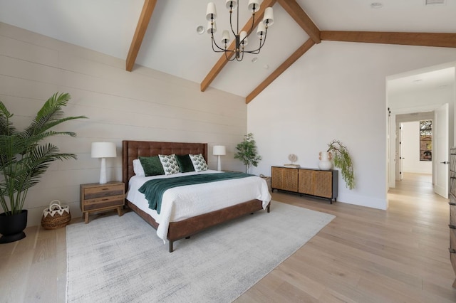 bedroom with beam ceiling, light wood finished floors, radiator, an inviting chandelier, and high vaulted ceiling