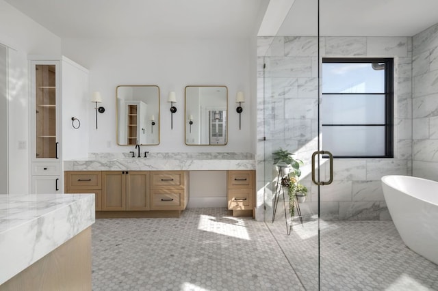 bathroom featuring a shower stall, a freestanding bath, tile walls, and vanity