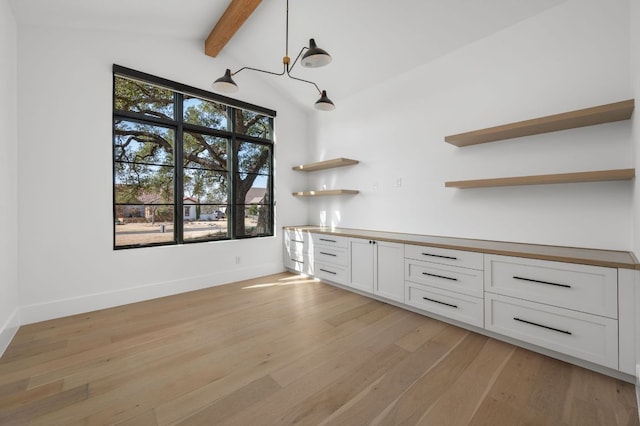 200 Birdstone Ln, Georgetown, TX 78628 - unfurnished dining area featuring light wood finished floors and beam ceiling