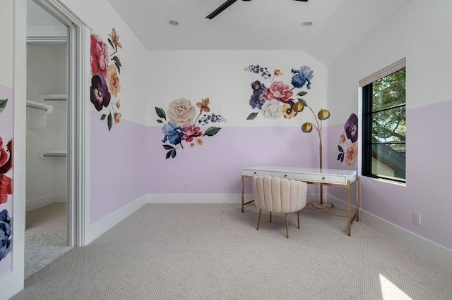 office space with lofted ceiling, carpet, baseboards, and ceiling fan