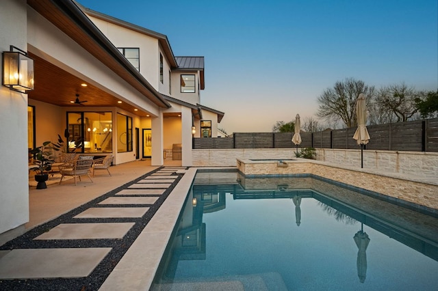 200 Birdstone Ln, Georgetown, TX 78628 - pool at dusk featuring a patio and a fenced backyard