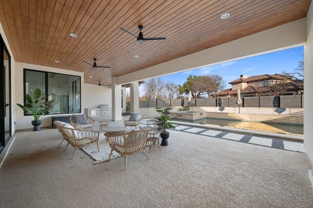 200 Birdstone Ln, Georgetown, TX 78628 - fenced backyard with area for grilling, a patio area, and ceiling fan