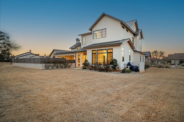 200 Birdstone Ln, Georgetown, TX 78628 - back of property featuring a standing seam roof, stucco siding, and a metal roof