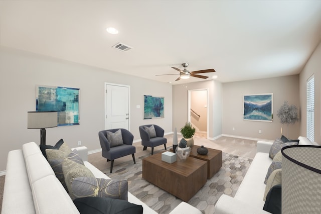 living room featuring light carpet, visible vents, recessed lighting, and baseboards