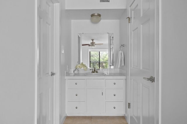 full bathroom featuring tile patterned flooring, visible vents, and vanity