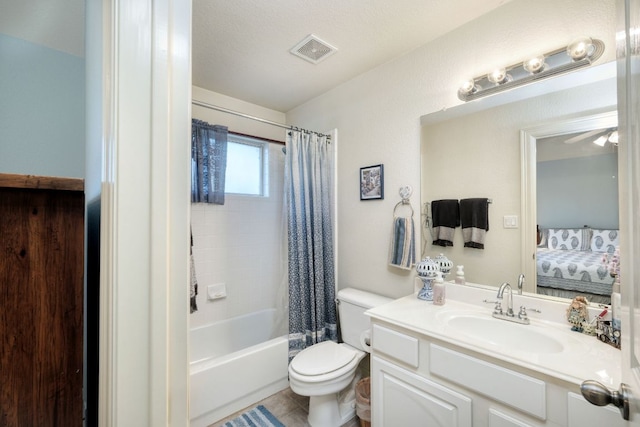 ensuite bathroom with connected bathroom, toilet, vanity, visible vents, and shower / tub combo with curtain