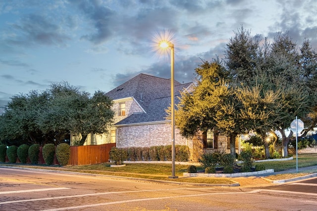 view of property exterior featuring fence