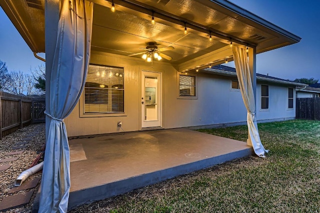 view of patio featuring ceiling fan and a fenced backyard