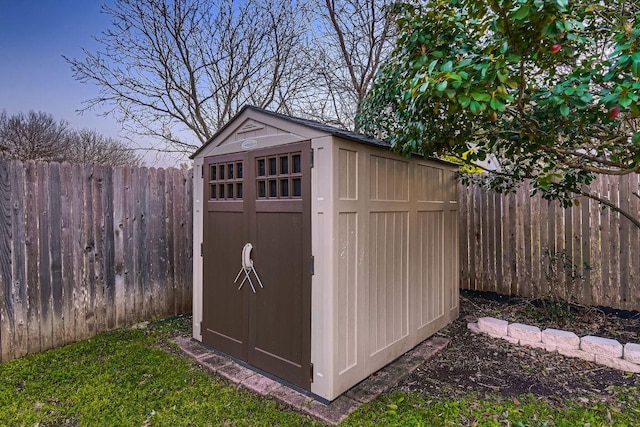 view of shed featuring a fenced backyard