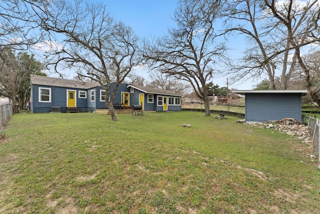 view of yard featuring entry steps and a fenced backyard