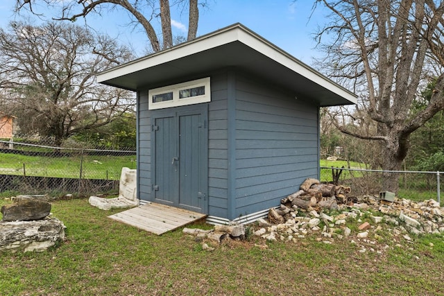 view of shed with a fenced backyard