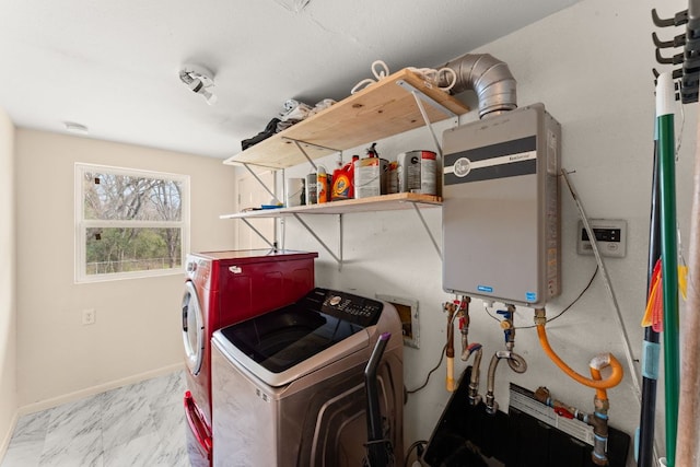 washroom with laundry area, baseboards, marble finish floor, and separate washer and dryer