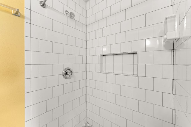 bathroom with tiled shower