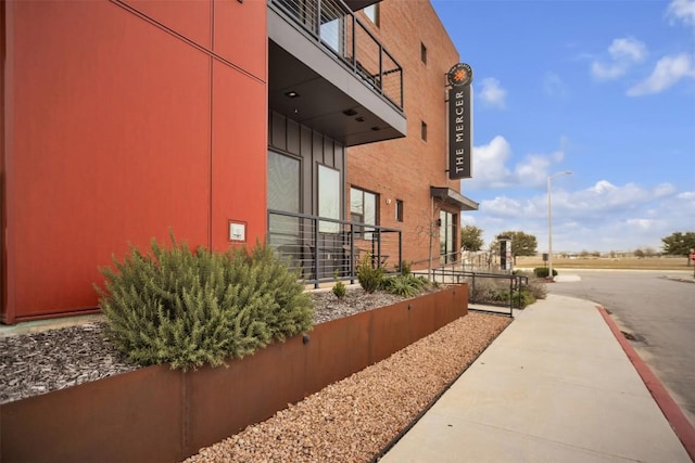 view of property exterior featuring a balcony