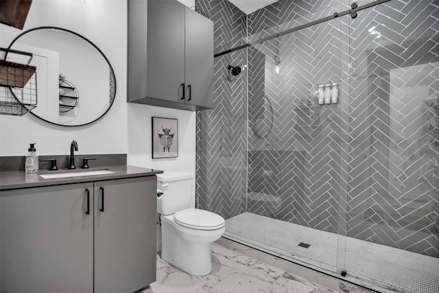 full bath featuring marble finish floor, vanity, a shower stall, and toilet