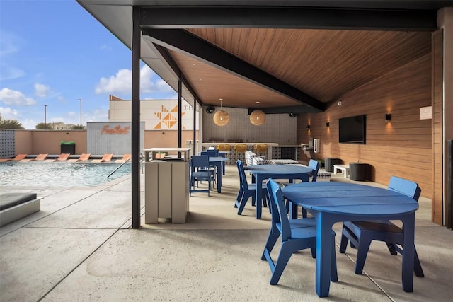 view of patio / terrace featuring fence and outdoor dining space