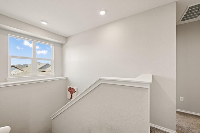 stairway featuring recessed lighting, carpet flooring, visible vents, and baseboards