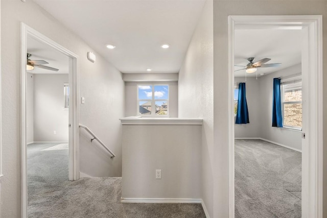 2950 E Old Settlers Blvd Unit 55, Round Rock, TX 78665 - hallway with an upstairs landing, carpet, healthy amount of natural light, and recessed lighting