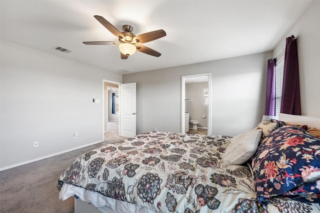 bedroom featuring ceiling fan, carpet flooring, visible vents, baseboards, and ensuite bath