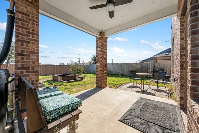 view of patio featuring a ceiling fan and a fenced backyard