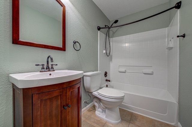 full bath featuring a textured wall, toilet, tile patterned floors, vanity, and shower / bathing tub combination