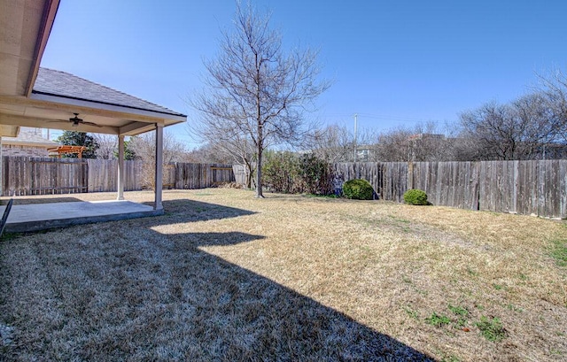 view of yard with ceiling fan, a patio, and a fenced backyard