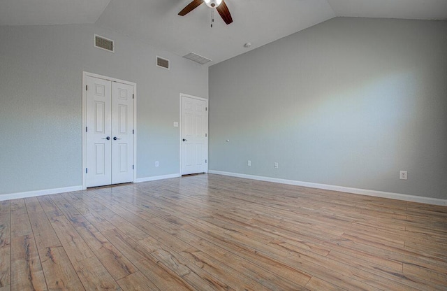 unfurnished room featuring light wood-style floors, ceiling fan, visible vents, and baseboards