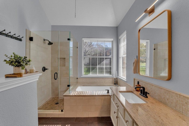 full bathroom with vanity, a shower stall, a bath, and tile patterned floors