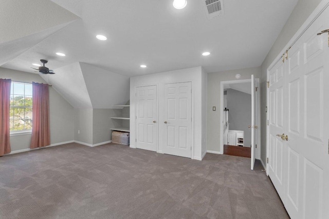 bonus room with lofted ceiling, recessed lighting, carpet floors, visible vents, and baseboards