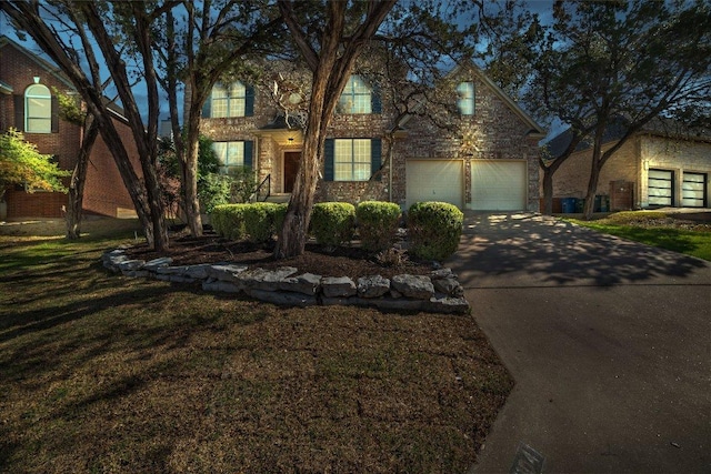 view of front facade with driveway and an attached garage