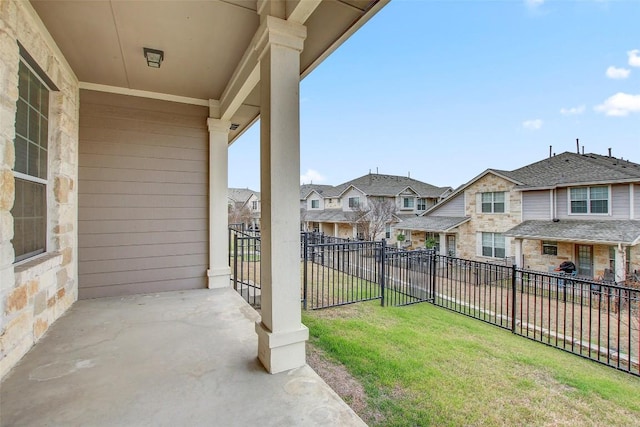 view of yard featuring a fenced backyard and a residential view