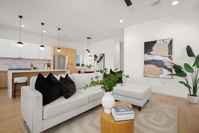 3402 Goodwin Ave Unit 1, Austin, TX 78702 - living room with light wood-style floors, recessed lighting, baseboards, and a ceiling fan