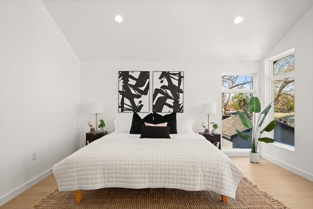 3402 Goodwin Ave Unit 1, Austin, TX 78702 - bedroom with vaulted ceiling, light wood-style floors, recessed lighting, and baseboards