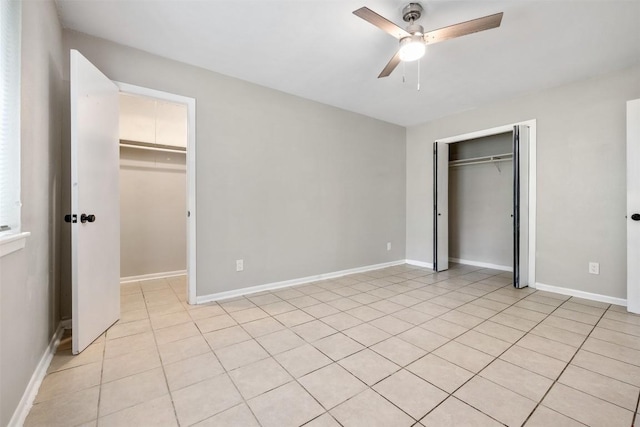 unfurnished bedroom featuring a closet, ceiling fan, and baseboards