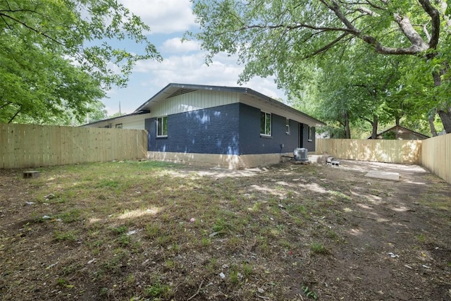 exterior space with a fenced backyard