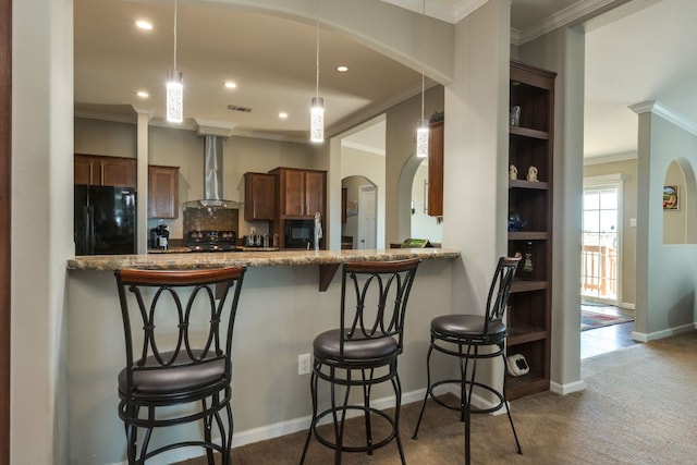 kitchen featuring arched walkways, wall chimney exhaust hood, crown molding, black appliances, and open shelves