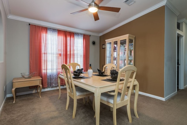 dining space featuring carpet floors, ornamental molding, visible vents, and baseboards