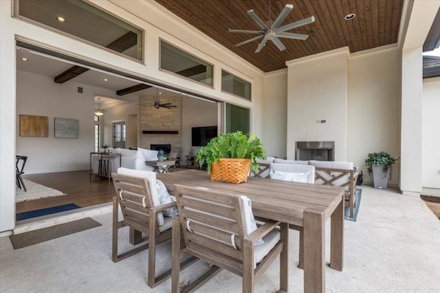 view of patio / terrace featuring an outdoor hangout area, outdoor dining area, and a ceiling fan